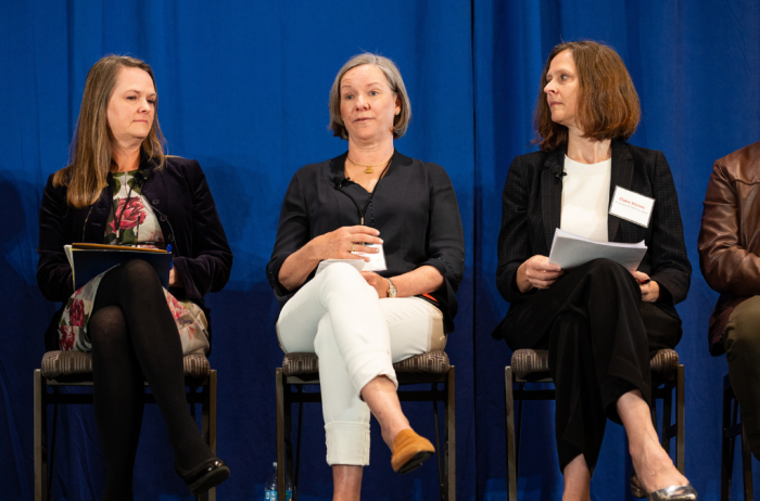 Panel sits on stage at the 2022 ACLS Annual Meeting