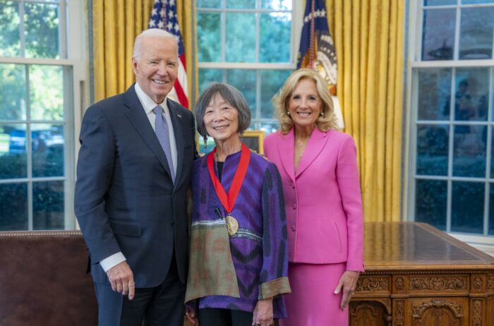 ACLS President Emerita Pauline Yu stands with President Joe Biden and First Lady Jill Biden after receiving a 2022 National Humanities Medal